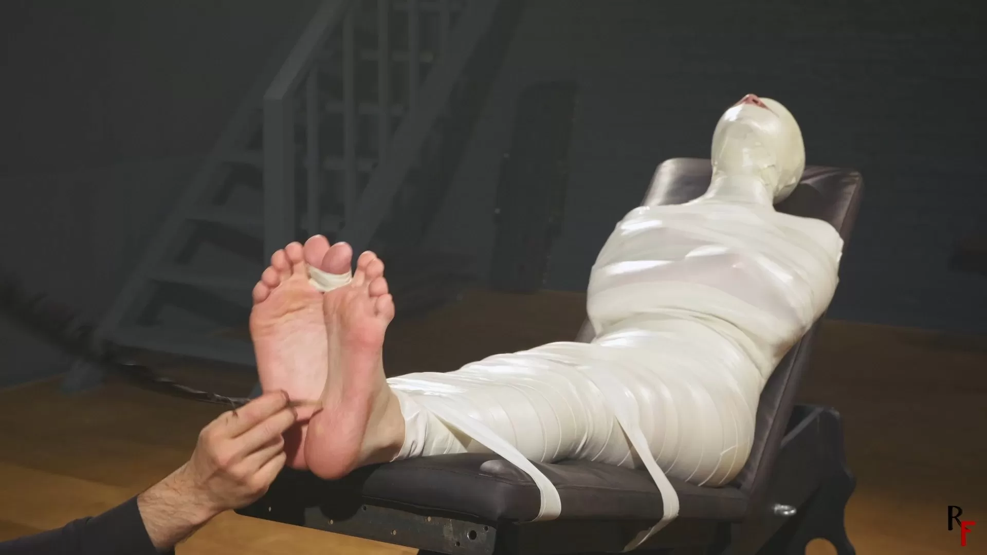 RFStudioProduction – Astrid in a Sleek Microfoam Cocoon Part 4 – Foot Tickling.webp